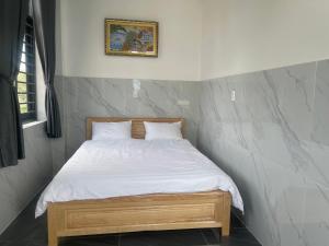 Postel nebo postele na pokoji v ubytování Ánh Mai Hotel