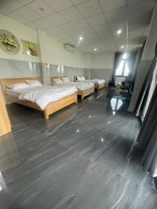 Postel nebo postele na pokoji v ubytování Ánh Mai Hotel