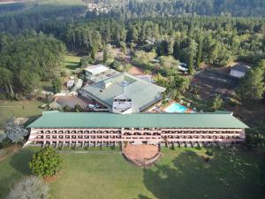 an overhead view of a large building with a pool at Piggs Peak Hotel in Piggs Peak