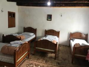 Postel nebo postele na pokoji v ubytování Marash Rrgalla Guesthouse