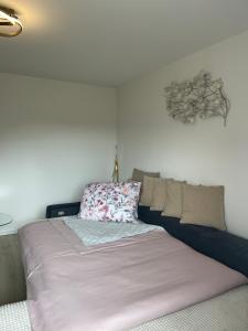 a bed sitting in a room with at Albblick in Albstadt