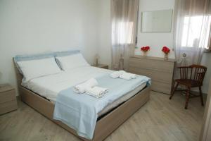 Postel nebo postele na pokoji v ubytování Casa Donatella a Isola + 12 fotografií