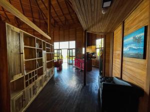 a living room with a couch and wooden walls at Villa Russerangan Grand Opening in Praya