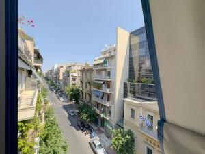 a view from a window of a street with buildings at Aristotelous Spacious 109sqm apt in Athens in Athens