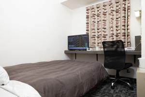 TV a/nebo společenská místnost v ubytování Kurashiki Station Hotel