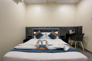 Postel nebo postele na pokoji v ubytování DIAMOND HOTEL