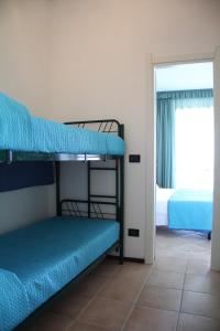 A bed or beds in a room at Residence Le Vele