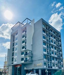 a hotel with a car parked in front of it at Aston Residence Hatyai 