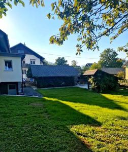 a view of a yard with a building at Aparthouse Jana Breg in Žirovnica