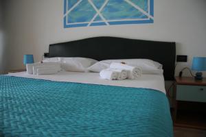 A bed or beds in a room at Residence Le Vele