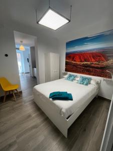 Cama o camas de una habitación en APARTAMENTOS MAPAMUNDI