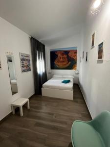 Cama o camas de una habitación en APARTAMENTOS MAPAMUNDI