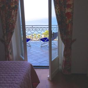Postel nebo postele na pokoji v ubytování B&B Le Palme