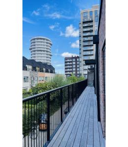 a boardwalk in the middle of a city with tall buildings at ApartmentInCopenhagen Apartment 1561 in Copenhagen