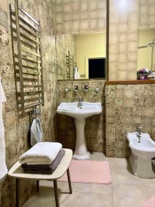 a bathroom with a sink and a toilet at Villa-Sofia Mini-hotel in Odesa
