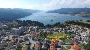 an aerial view of a city and a lake at ЕЛЕГАНС къща за гости in Dospat