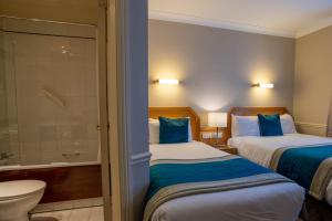 Letto o letti in una camera di Harcourt Hotel
