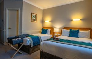 Letto o letti in una camera di Harcourt Hotel