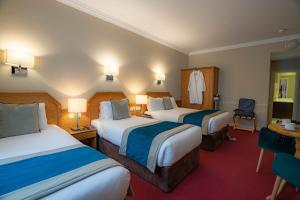 Letto o letti in una camera di Harcourt Hotel