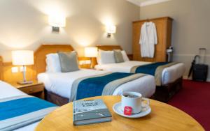 Letto o letti in una camera di Harcourt Hotel