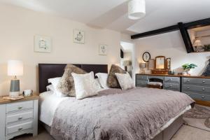 Voodi või voodid majutusasutuse Landlord's Cottage toas