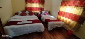 Katil atau katil-katil dalam bilik di Hotel Plaza Nepal