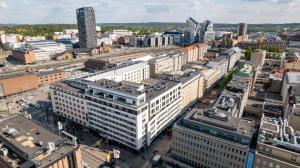 an aerial view of a city with tall buildings at 2ndhomes Tampere "Lumilinna" Apartment - 1BR New Apt in the Heart of the City in Tampere