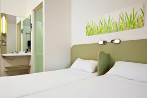 Postel nebo postele na pokoji v ubytování ibis budget Beaconsfield