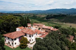an aerial view of a house with a vineyard at Exclusive Wine Resort - Villa Dianella in Vinci