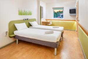 Postel nebo postele na pokoji v ubytování ibis budget Beaconsfield