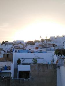 a view of a city with white buildings at Dar Gara in Tangier
