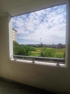 a window in a room with a view of a field at La casa di Greta in Monza