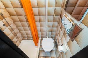 an overhead view of a toilet in a small room at House Brunac with parking in Vodice