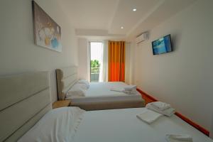Voodi või voodid majutusasutuse Hotel Summer toas