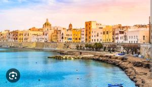 a view of a river in a city with buildings at La casetta di Lula in Trapani