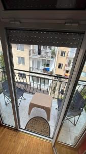 a view of a balcony with a table and chairs at Apartman MIA in Ohrid