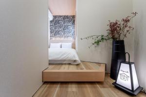Ein Bett oder Betten in einem Zimmer der Unterkunft 【Oyado街】宿泊者限定！貸切クルーザー・SUPツアー　別荘感覚で新築一軒家貸切ハウステンボス近く