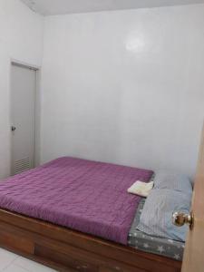 Voodi või voodid majutusasutuse Home in General Santos City toas