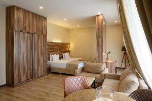 a hotel room with a bed and a bedroom at Nacho by Stellar Hotels, Yerevan in Yerevan