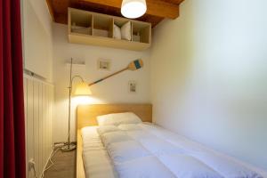 Katil atau katil-katil dalam bilik di Ferienhaus am Mönchneversdorfer See
