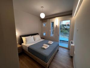 Elia Luxury Residence客房内的一张或多张床位
