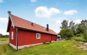 a red barn with a red roof at Stunning Home In Vittsj With 3 Bedrooms in Vittsjö