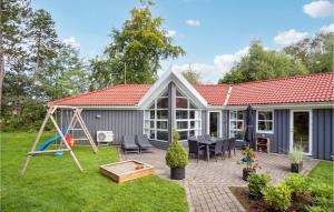 a backyard with a playground and a house at Pet Friendly Home In Knebel With Wifi in Knebel