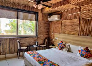 a bedroom with a bed in a room with wooden walls at Heritage Hotel in Lucknow