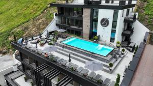 an aerial view of a building with a swimming pool at Hotel Zalwonder in Ischgl