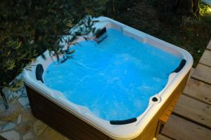 a hot tub with blue water in it at Villa Tramonto D'Oro in Ulcinj