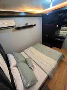 Ένα ή περισσότερα κρεβάτια σε δωμάτιο στο One Oasis Condominium 2 Bedroom