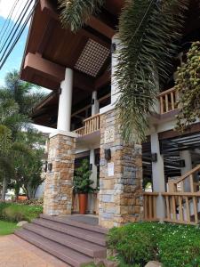 a building with a porch and stairs in front of it at One Oasis Condominium 2 Bedroom in Davao City