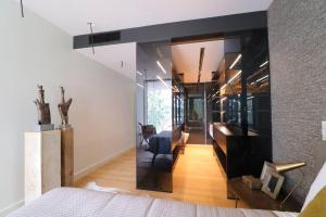 a bedroom with a bed and a living room at DOURO VIEWS Luxury Design Beach Apartment in Vila Nova de Gaia