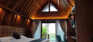 a bedroom with a bed and a large window at Love Without boundaries num9843 in Siyut